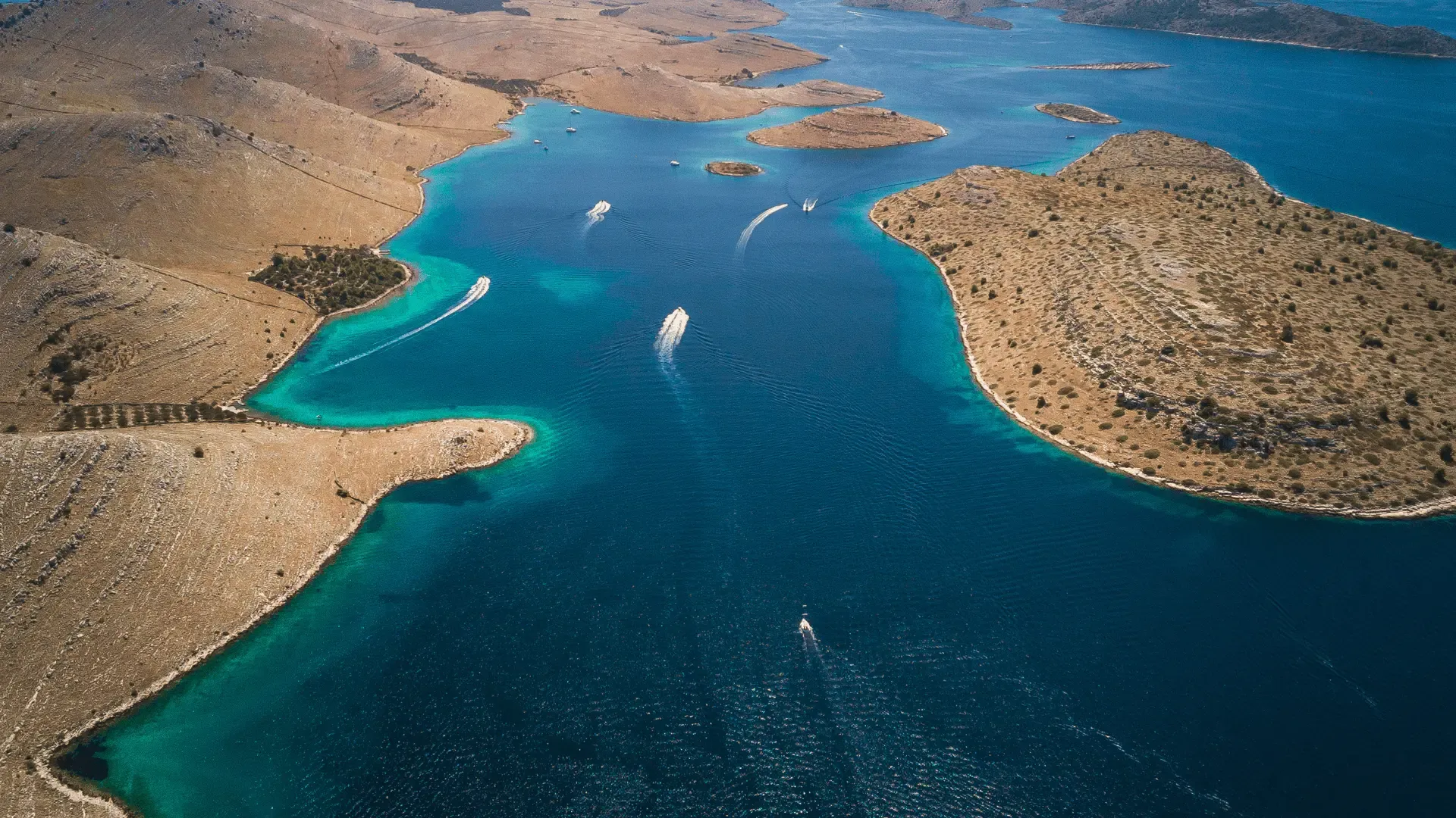 Luxury yacht sailing through deep blue waters
