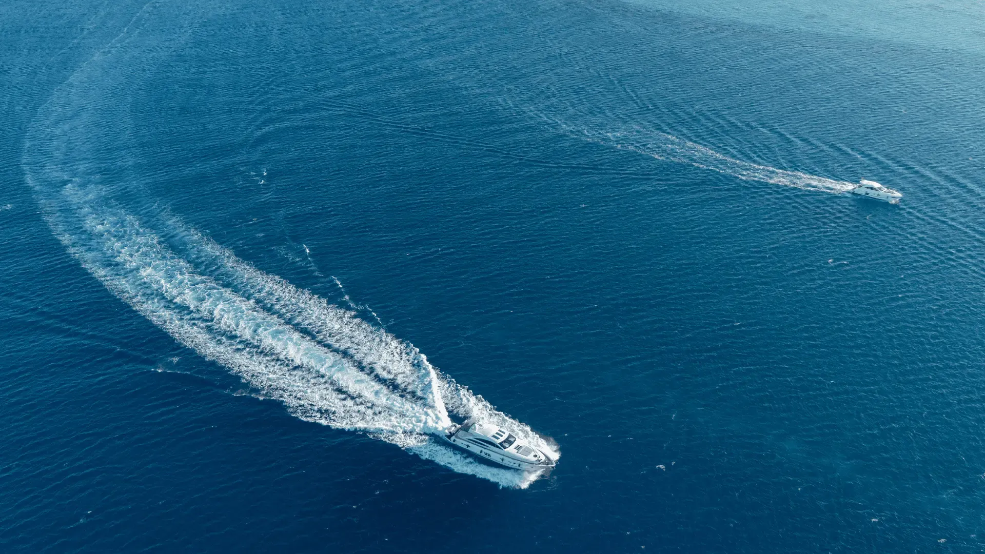 Luxury yacht sailing through deep blue waters